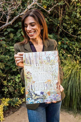 Woman holding Patterns Patterns Everywhere book.